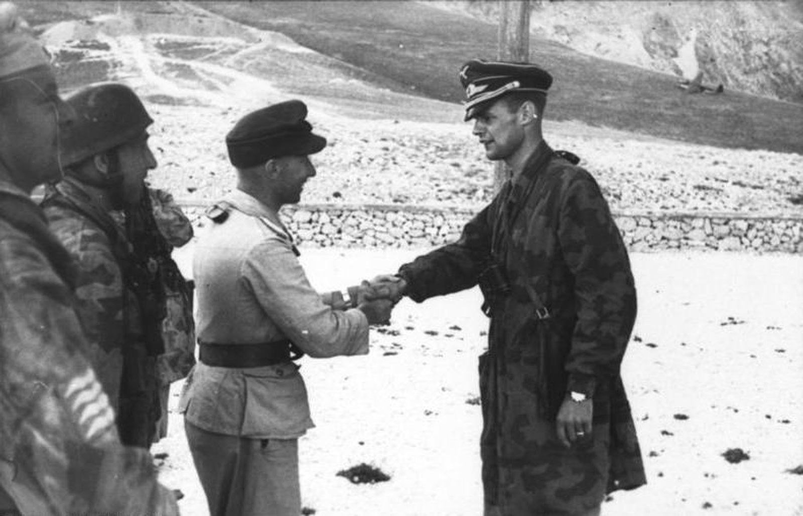 Major Harald-Otto Mors and Oberleutnant Georg von Berlepsch shake hands at Gran Sasso after Operation Oak on September 12, 1943.