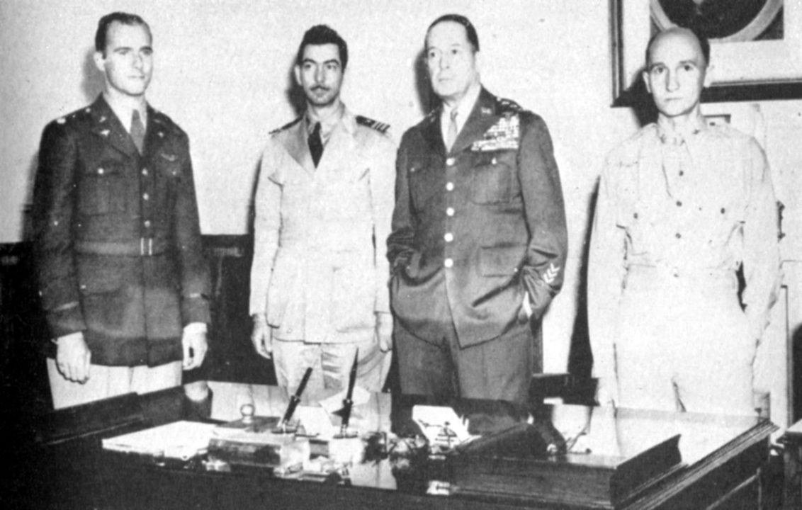 William Dyess, Melvyn McCoy and Stephen Mellnik reporting to General Douglas MacArthur in Brisbane after their escape