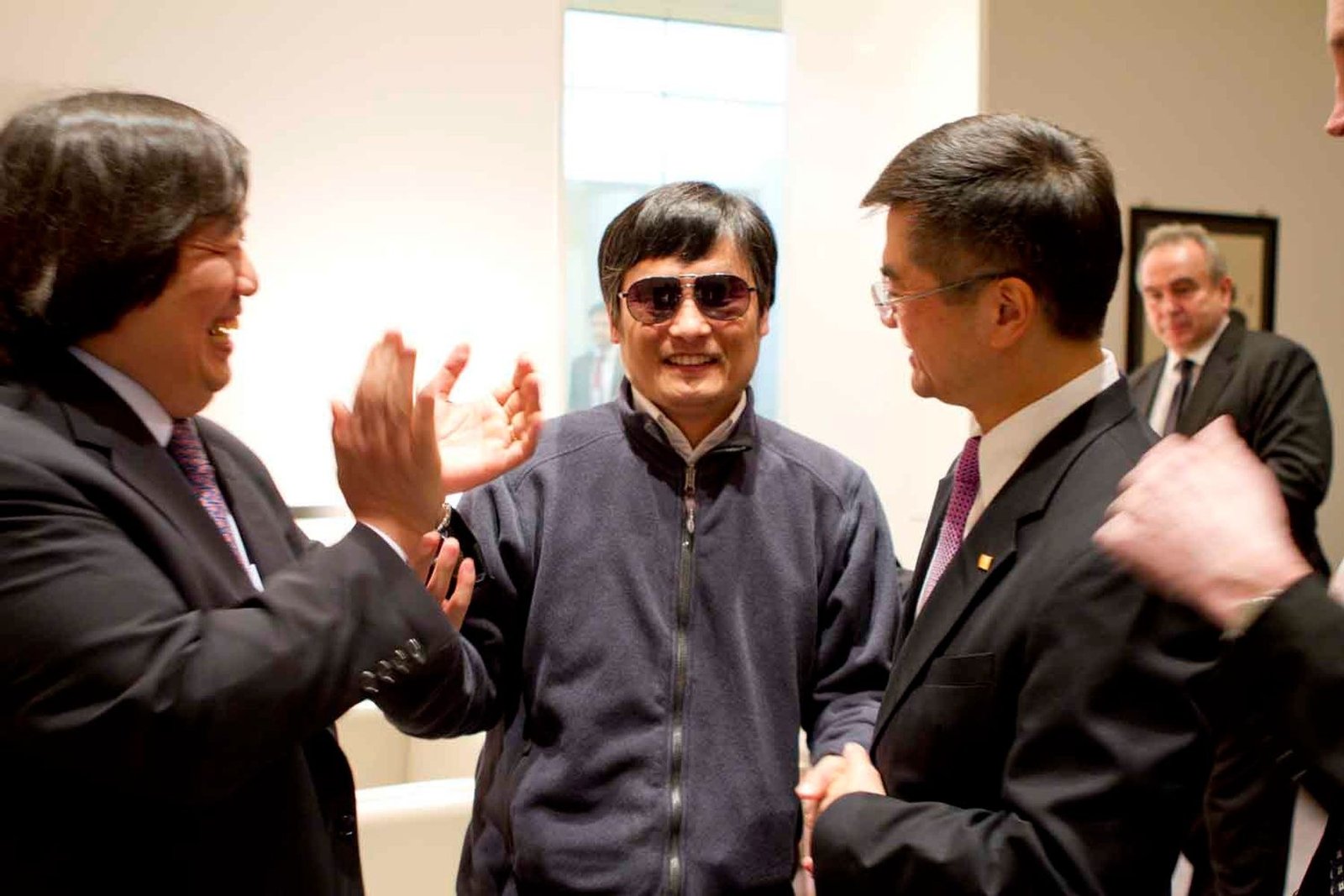Chen Guangcheng stands between U.S. State Department Legal Adviser Harold Koh and Ambassador Gary Locke inside the U.S. Embassy in Beijing on May 1, 2012.