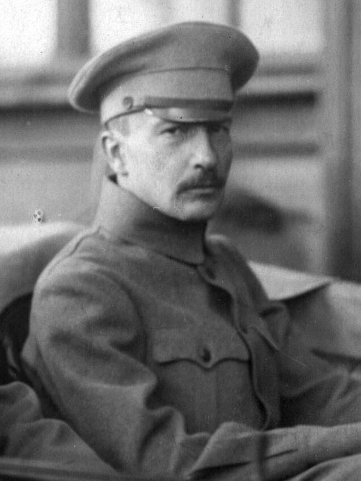 Boris Savinkov seated in military-style clothing and cap in a 1917 photograph.