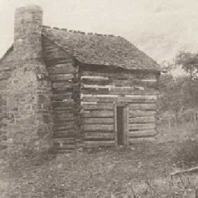 Black-and-white circa-1890 photograph of a small log cabin associated with William and Mary Draper Ingles near the New River.